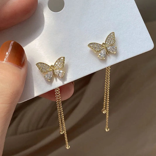 Brinco dourado de borboleta
